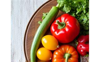 Healthy and colorful fresh vegetables arranged on a wooden board